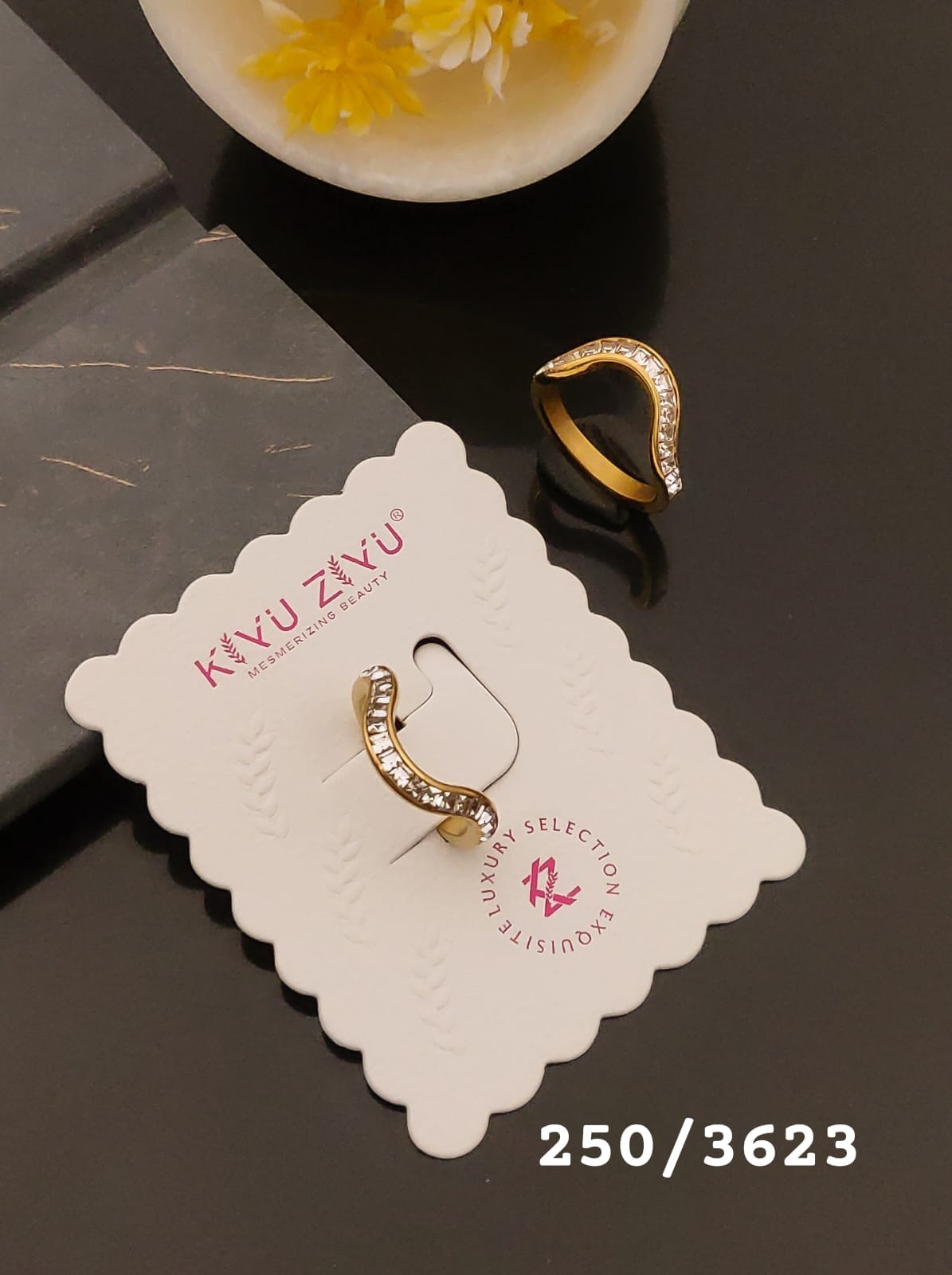 Elegant Gold-Tone Curved Crystal Ring